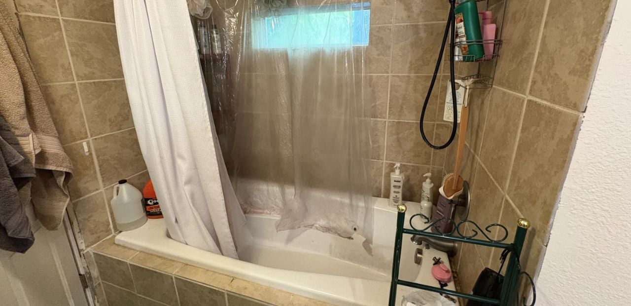 Old bathtub which is unsafe to get in and out